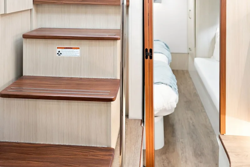 Slide: The Image of Interior stairs and cabin of 2025 Regal 42 Grande Coupe yacht. - 18