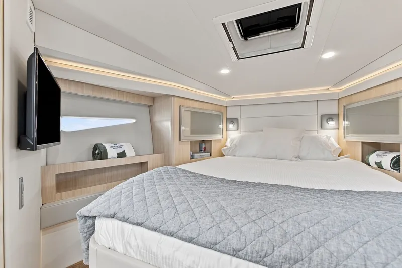 Slide: The Image of Luxurious bedroom interior of 2025 Regal 42 Grande Coupe yacht with modern amenities. - 25
