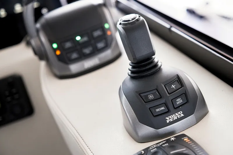 Slide: The Image of Joystick control system on 2025 Regal 42 Grande Coupe yacht, featuring Volvo Penta technology. - 17