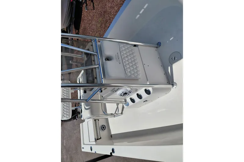 Slide: The Image of 2020 Cobia 21 Bay boat interior with steering console and seating. - 22