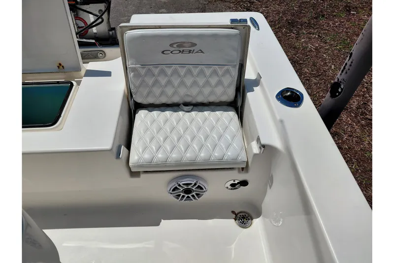 Slide: The Image of 2020 Cobia 21 Bay boat seat with diamond-pattern upholstery and speaker. - 33