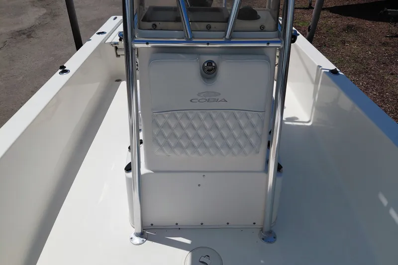 Slide: The Image of 2020 Cobia 21 Bay boat interior with console and stainless steel railings. - 20