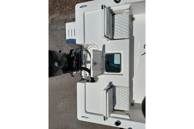 Slide: The Image of 2020 Cobia 21 Bay boat deck with seating and motor, viewed from above. - 30