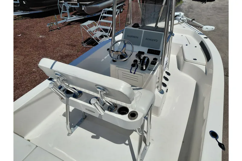 Slide: The Image of 2020 Cobia 21 Bay boat interior with Garmin navigation system and steering console. - 35