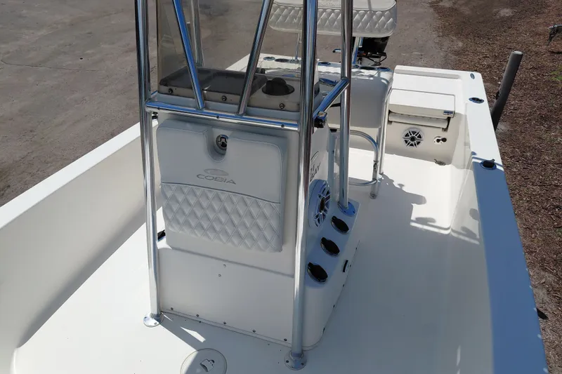Slide: The Image of 2020 Cobia 21 Bay boat interior with console and seating, showcasing sleek design. - 23