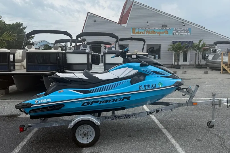 The Image of 2022 Yamaha GP-1800 jet ski on trailer outside Island Watersports store. - 1