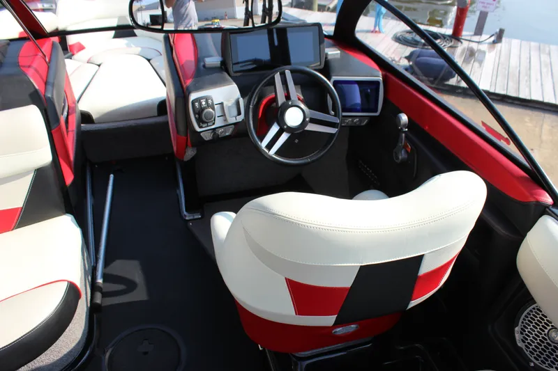 Slide: The Image of 2015 Malibu Wakesetter 22 VLX interior with modern dashboard and steering wheel. - 13