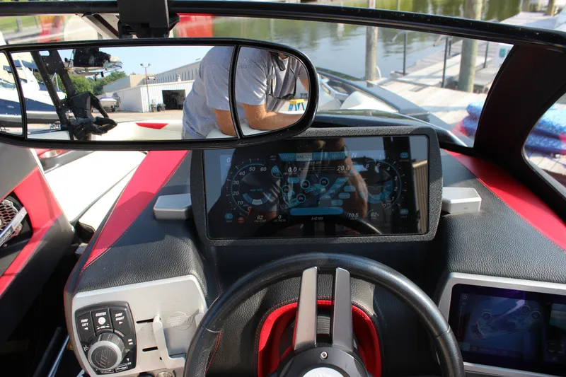 Slide: The Image of 2015 Malibu Wakesetter 22 VLX dashboard with touchscreen controls and rearview mirror. - 25