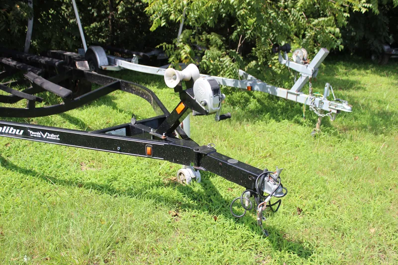 Slide: The Image of 2015 Malibu Wakesetter 22 VLX boat trailer on grassy area. - 39