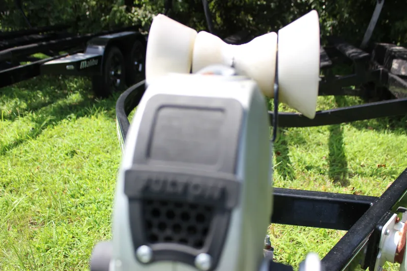 Slide: The Image of Trailer hitch of a 2015 Malibu Wakesetter 22 VLX on grassy background. - 52