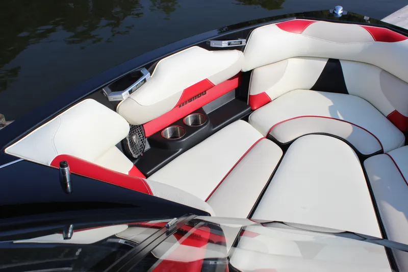 Slide: The Image of 2015 Malibu Wakesetter 22 VLX boat interior with red and white seating. - 8