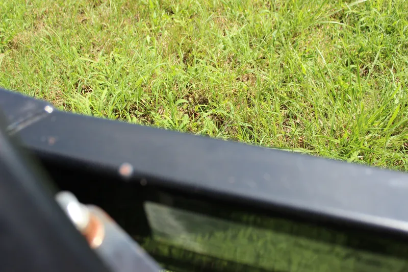 Slide: The Image of Close-up of a 2015 Malibu Wakesetter 22 VLX part against green grass. - 51