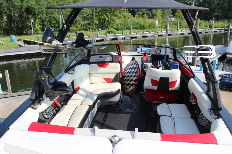 Slide: The Image of 2015 Malibu Wakesetter 22 VLX interior with stylish seating and wakeboard racks. - 32