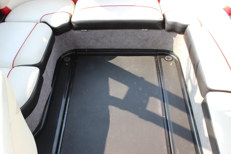 Slide: The Image of Interior seating of 2015 Malibu Wakesetter 22 VLX boat with white and red upholstery. - 10