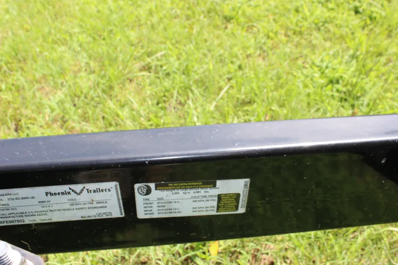 Slide: The Image of Trailer label for 2015 Malibu Wakesetter 22 VLX on grass background. - 50