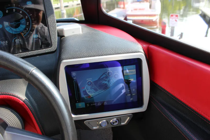 Slide: The Image of Dashboard of 2015 Malibu Wakesetter 22 VLX with touchscreen controls and gauges. - 29
