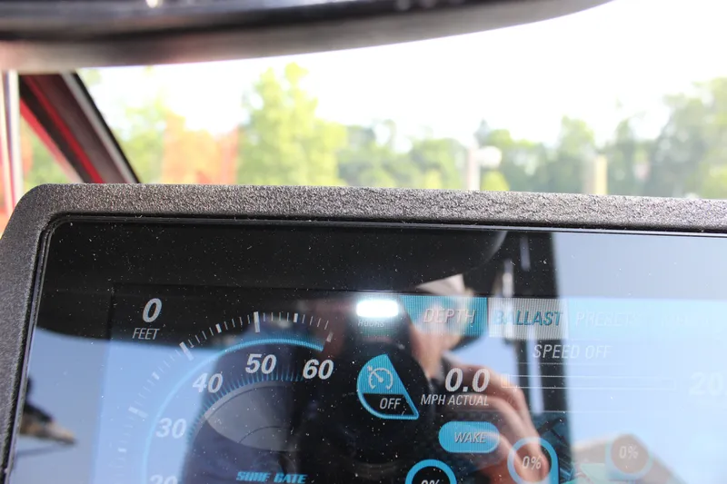 Slide: The Image of Dashboard of a 2015 Malibu Wakesetter 22 VLX boat showing speed and settings. - 28