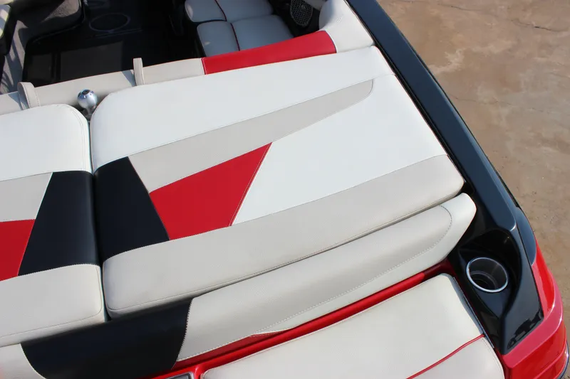 Slide: The Image of 2015 Malibu Wakesetter 22 VLX boat interior with red, black, and white seating. - 6