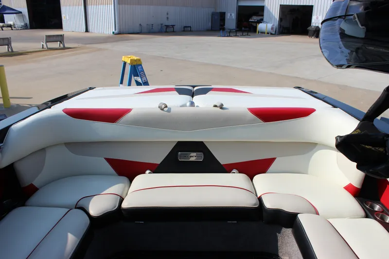 Slide: The Image of Interior of a 2015 Malibu Wakesetter 22 VLX boat with red and white seating. - 21