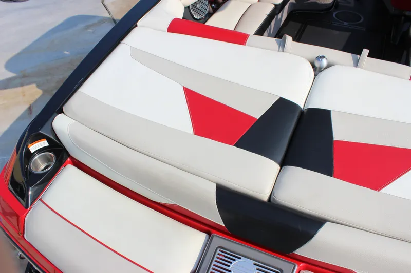 Slide: The Image of 2015 Malibu Wakesetter 22 VLX boat interior with red, black, and beige seating design. - 5