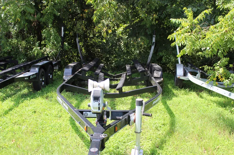 Slide: The Image of 2015 Malibu Wakesetter 22 VLX boat trailer parked on grassy area. - 41