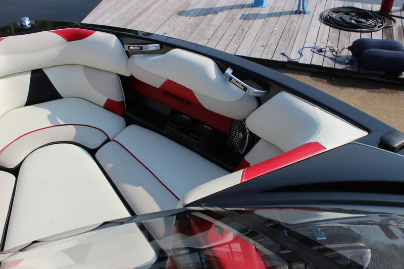 Slide: The Image of Luxurious interior of 2015 Malibu Wakesetter 22 VLX boat with red and white seating. - 9