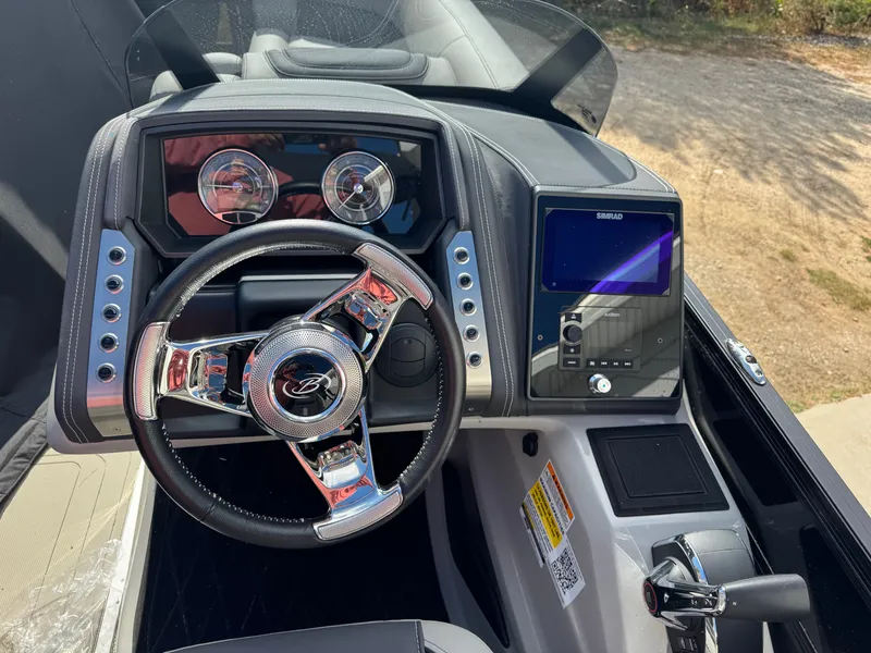 Slide: The Image of The image shows the helm of a 2024 Barletta Lusso 23M with modern instruments. - 7