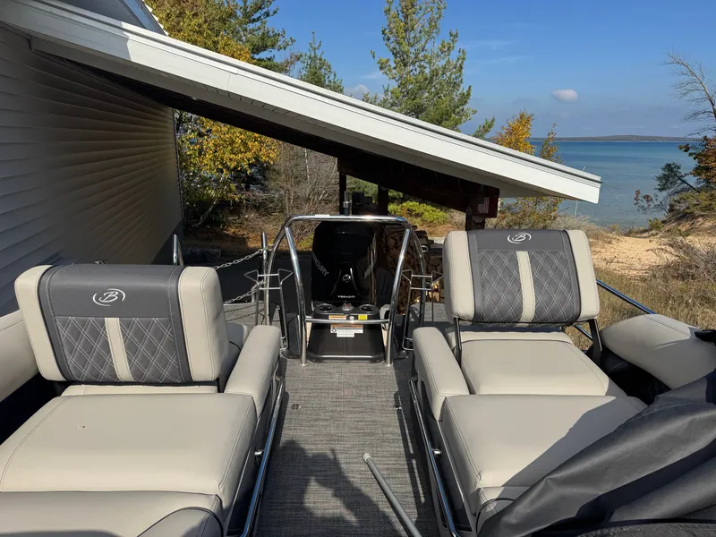 Slide: The Image of The image shows the deck of a 2024 Barletta Lusso 23M with luxurious seating. - 6
