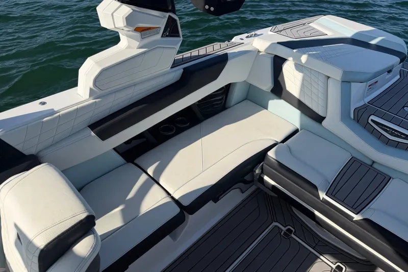 Slide: The Image of Luxurious seating on 2023 Nautique Super Air Nautique G23 boat, featuring sleek design and premium materials. - 15