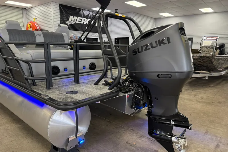 Slide: The Image of 2026 Bentley Pontoons Elite 223 Swingback with Suzuki outboard motor in showroom. - 20