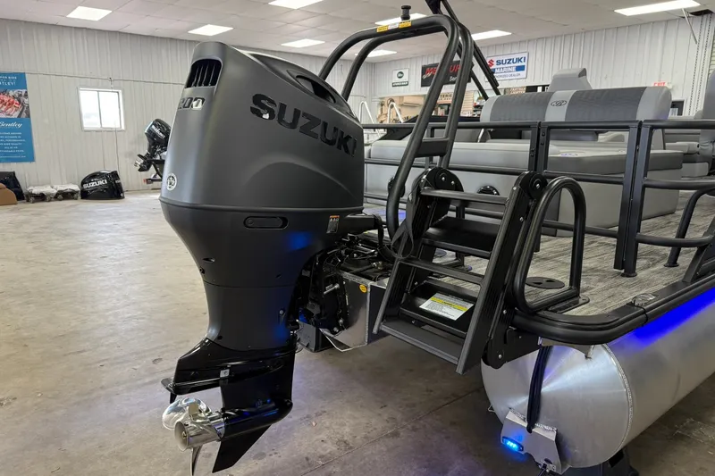 Slide: The Image of 2026 Bentley Pontoons Elite 223 Swingback with Suzuki outboard motor in showroom. - 21