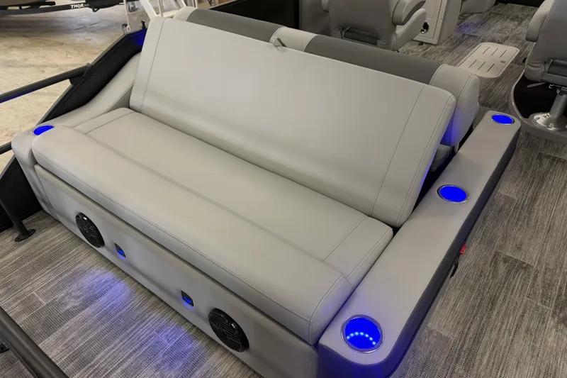 Slide: The Image of 2026 Bentley Pontoons Elite 223 Swingback with luxurious seating and illuminated cup holders. - 13
