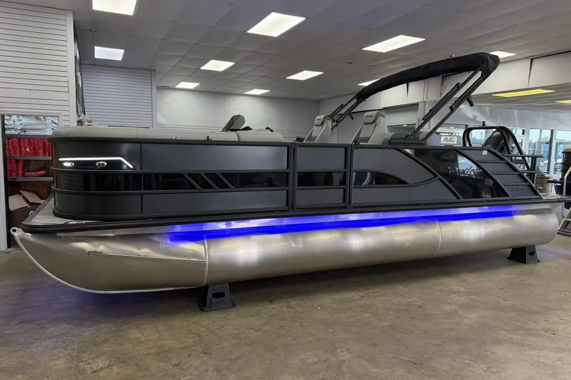 Slide: The Image of 2026 Bentley Pontoons Elite 223 Swingback with sleek design and blue underglow lighting. - 1