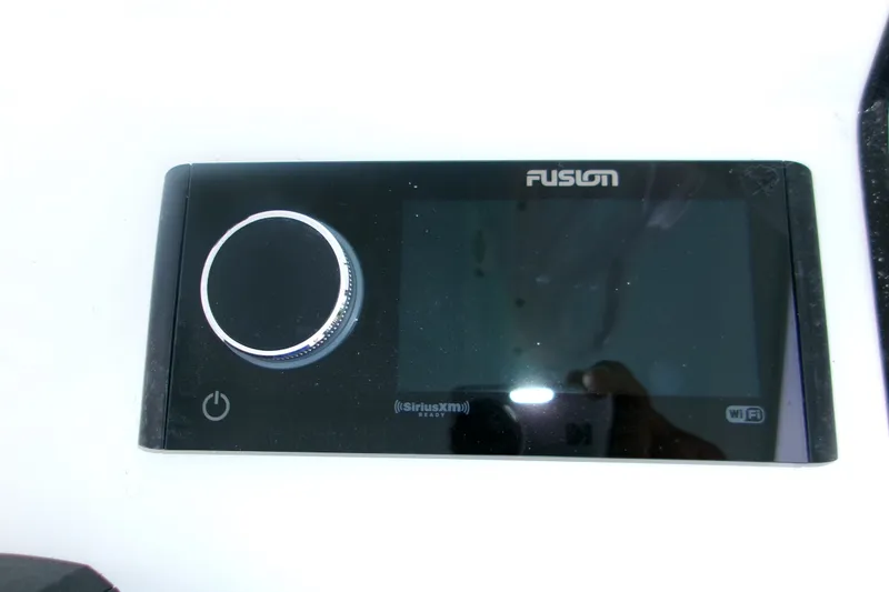 Slide: The Image of Fusion marine stereo system on 2027 Sportsman Heritage 231 Center Console boat. - 9