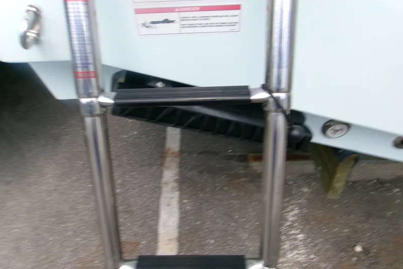 Slide: The Image of Stainless steel ladder on 2027 Sportsman Heritage 231 Center Console boat. - 2