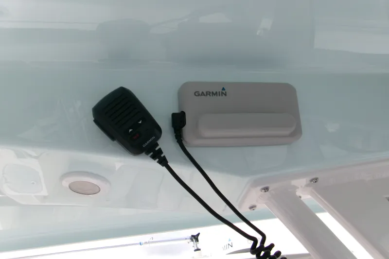 Slide: The Image of Garmin marine radio equipment on 2027 Sportsman Heritage 231 Center Console boat. - 7
