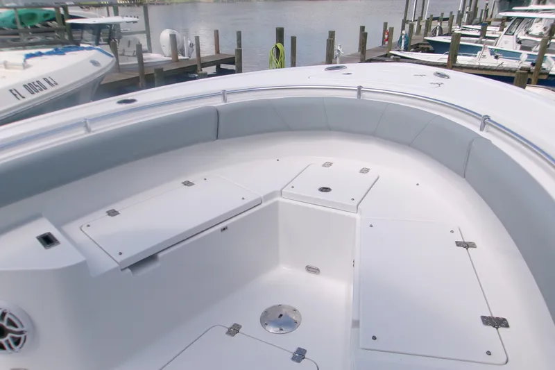 Slide: The Image of 2027 Sportsman Heritage 231 Center Console boat interior with seating and storage compartments. - 10