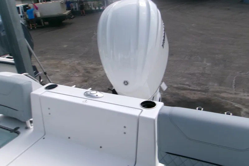 Slide: The Image of 2027 Sportsman Heritage 231 Center Console boat with powerful outboard motor. - 5