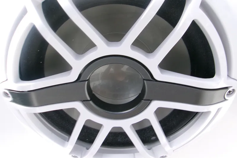 Slide: The Image of Close-up of a speaker grille on a 2027 Sportsman Heritage 231 Center Console boat. - 14