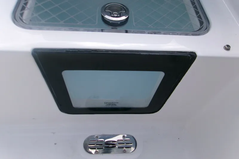 Slide: The Image of 2027 Sportsman Heritage 231 Center Console boat detail, featuring a sleek hatch and vent. - 6