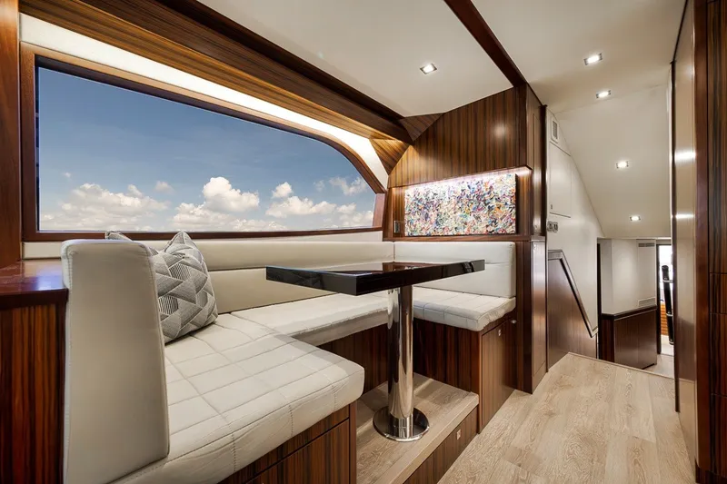 Slide: The Image of Luxurious interior of 2021 Hatteras GT65 Carolina yacht with elegant seating and modern decor. - 39