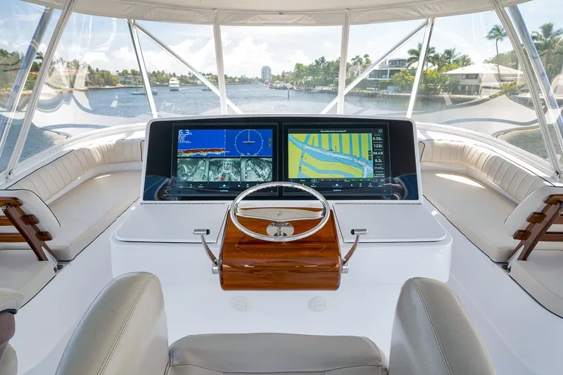 Slide: The Image of Helm of 2021 Hatteras GT65 Carolina yacht with advanced navigation displays. - 17