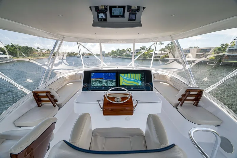 Slide: The Image of Luxurious helm of 2021 Hatteras GT65 Carolina yacht with advanced navigation systems. - 16