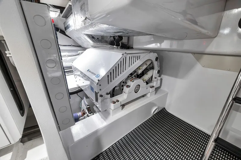 Slide: The Image of Engine room of 2021 Hatteras GT65 Carolina yacht, featuring advanced machinery and equipment. - 60