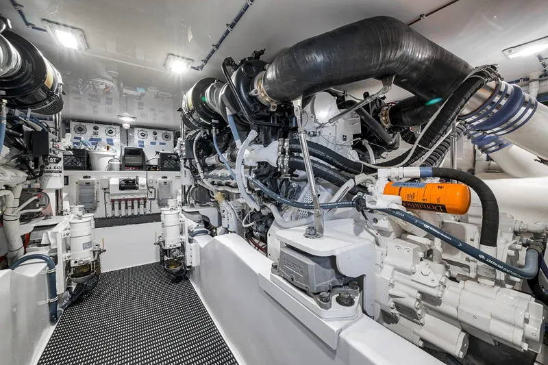 Slide: The Image of Engine room of 2021 Hatteras GT65 Carolina yacht, showcasing advanced machinery and equipment. - 51