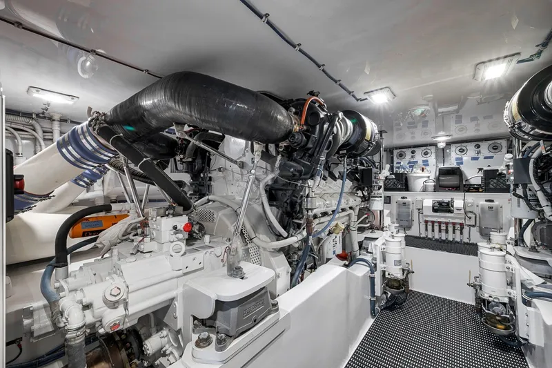 Slide: The Image of Engine room of 2021 Hatteras GT65 Carolina yacht, showcasing advanced machinery and equipment. - 52