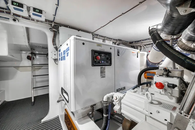 Slide: The Image of Engine room of 2021 Hatteras GT65 Carolina yacht with Kohler generator. - 59