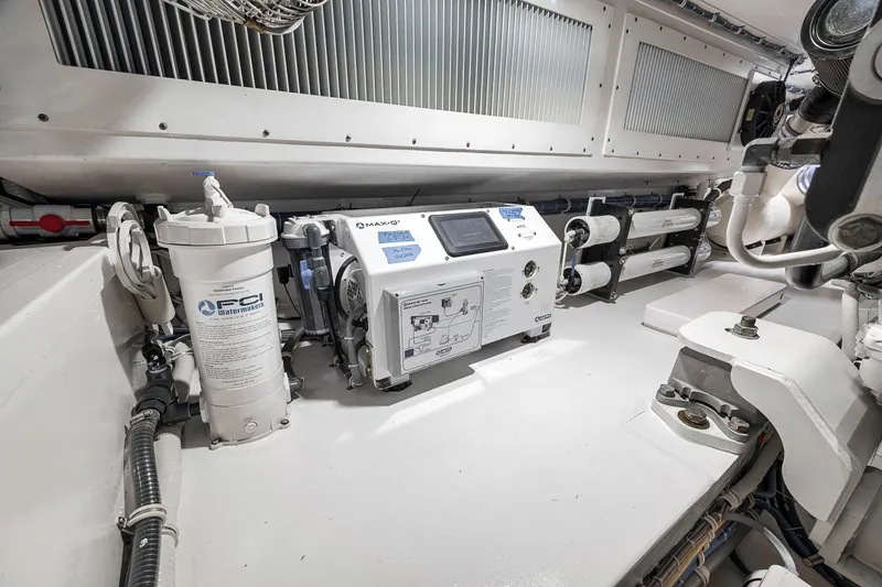 Slide: The Image of Engine room of 2021 Hatteras GT65 Carolina yacht with water filtration system. - 55