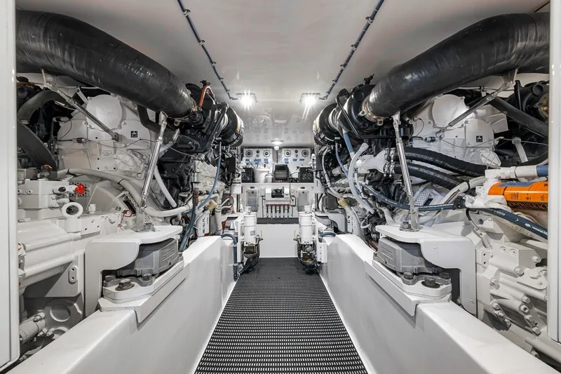 Slide: The Image of Engine room of 2021 Hatteras GT65 Carolina yacht, showcasing advanced machinery and equipment. - 50