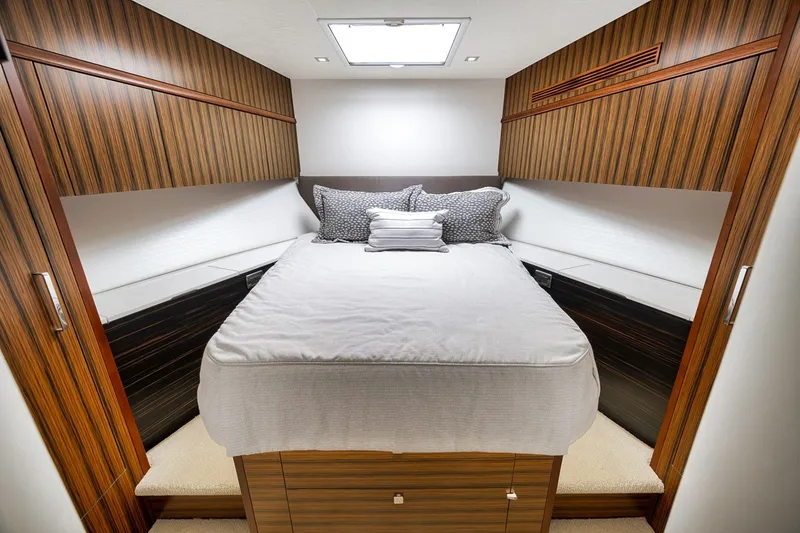 Slide: The Image of Luxurious cabin interior of 2021 Hatteras GT65 Carolina yacht with elegant wood finish. - 48